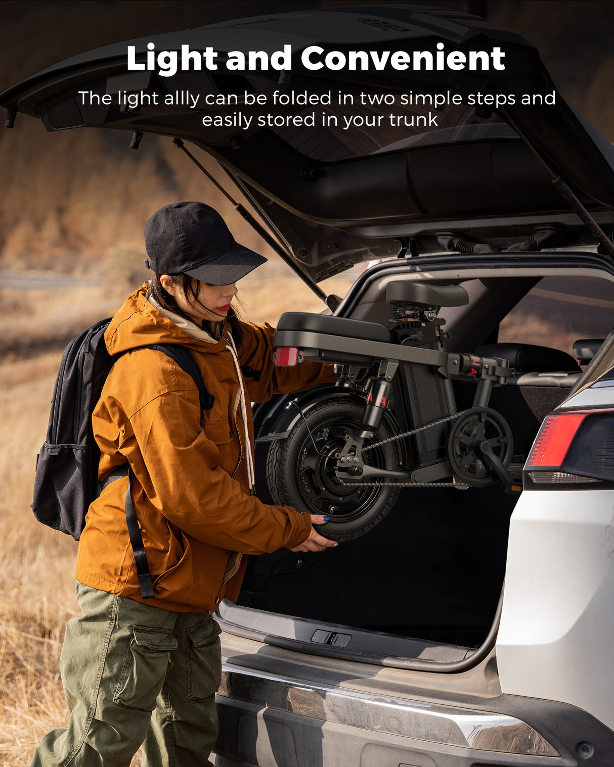a woman is putting a folded engwe 14 in the trunk of the car