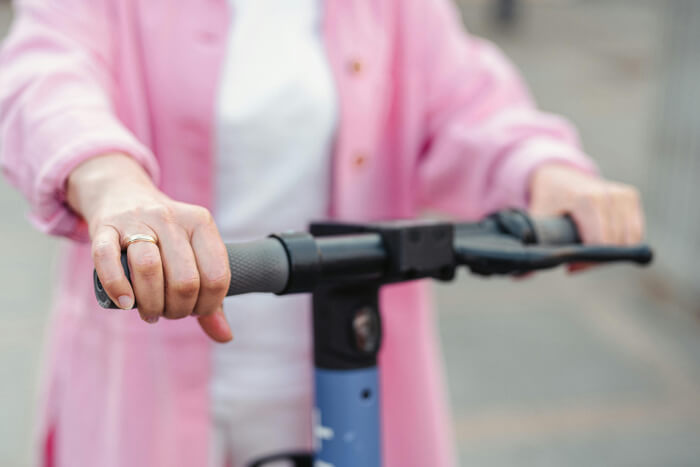 a pair of hands hold the handlebars