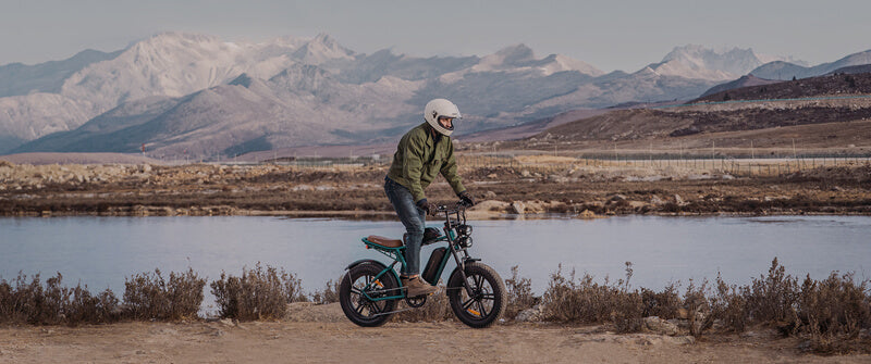a man stands on the best fat tire e-bike: engwe m20