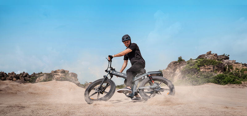 a man rides a black engwe x26 folding fat tire e bike