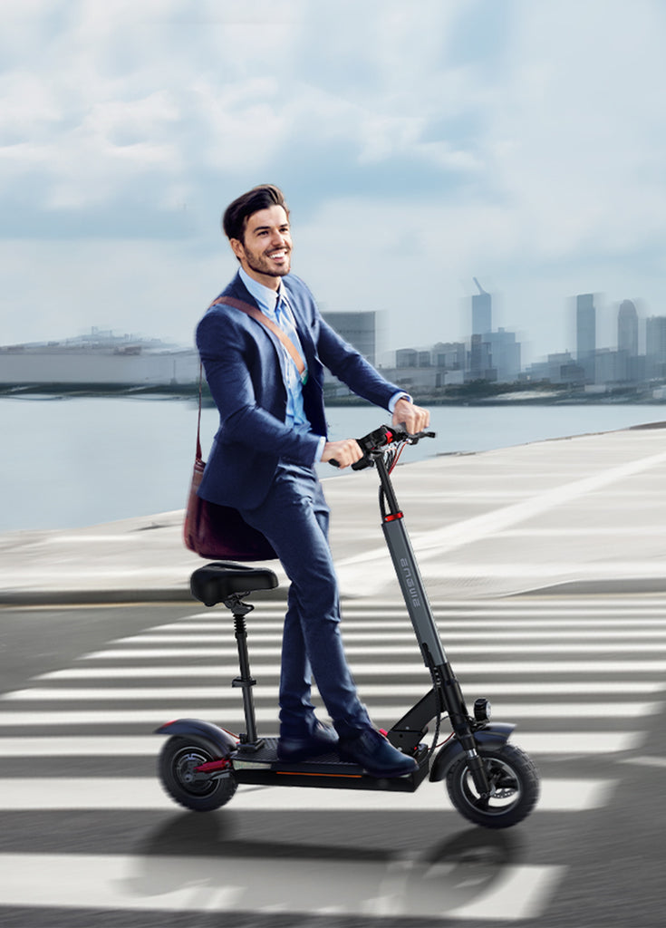 a male office worker in a suit rides an engwe y600 electric scooter