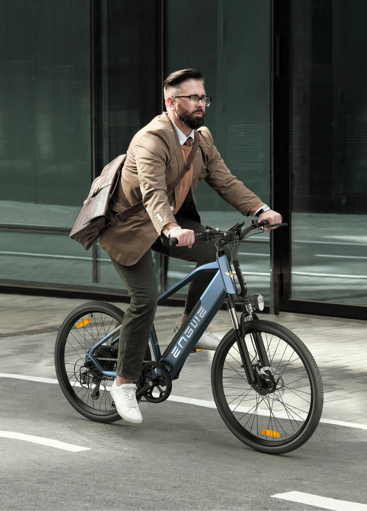 a man rides a blue engwe p26 electric city bike on the street